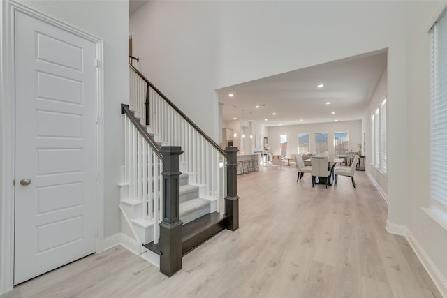 stairs with hardwood / wood-style floors