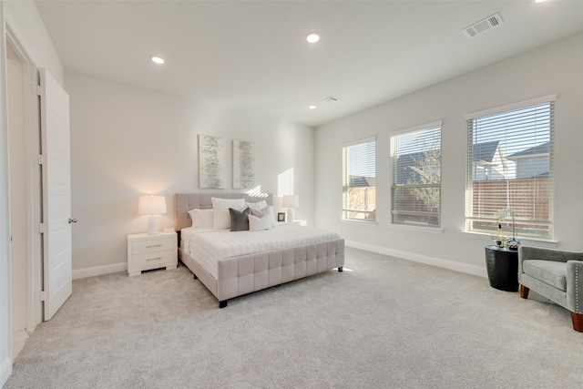 bedroom with light colored carpet