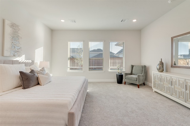 bedroom with light colored carpet