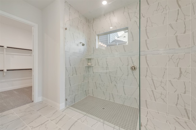 bathroom featuring a tile shower