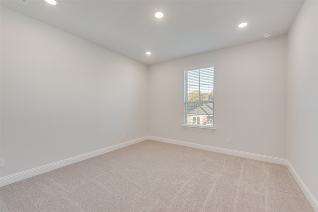 unfurnished room featuring carpet flooring