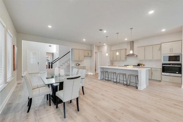 dining area with light hardwood / wood-style floors