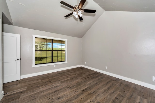 interior space with ceiling fan, dark hardwood / wood-style flooring, and lofted ceiling