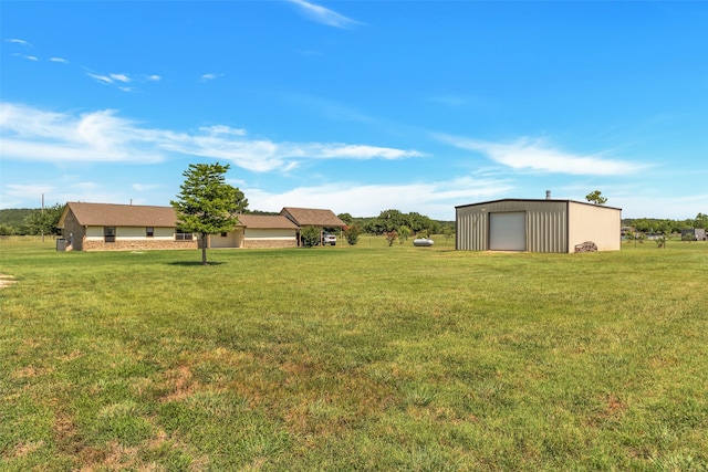 view of yard with a garage and an outdoor structure