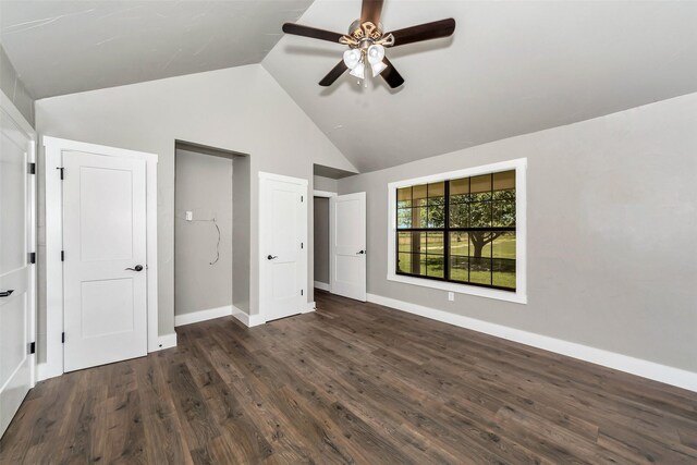 unfurnished bedroom with ceiling fan, dark wood-type flooring, and vaulted ceiling