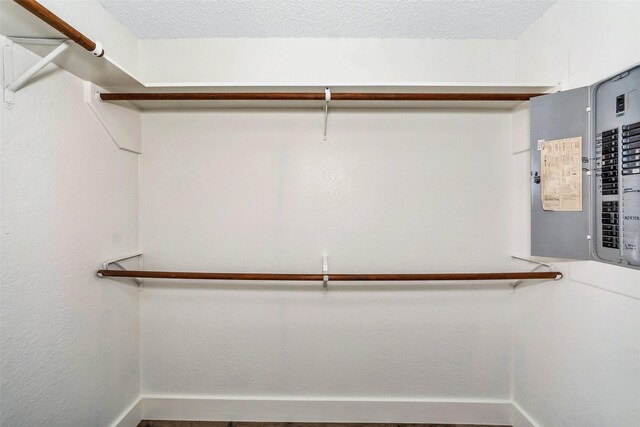 spacious closet featuring electric panel