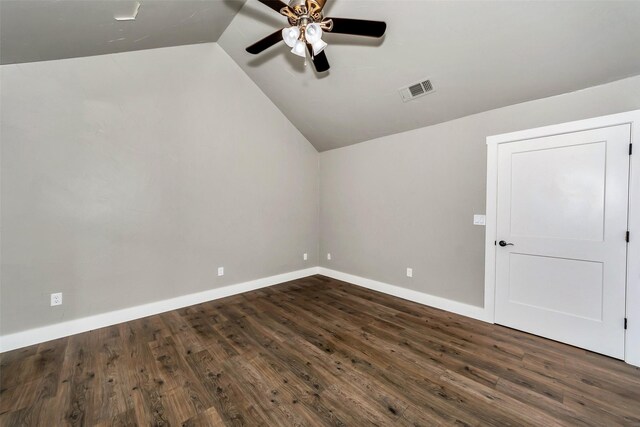 additional living space featuring dark hardwood / wood-style floors, ceiling fan, and vaulted ceiling