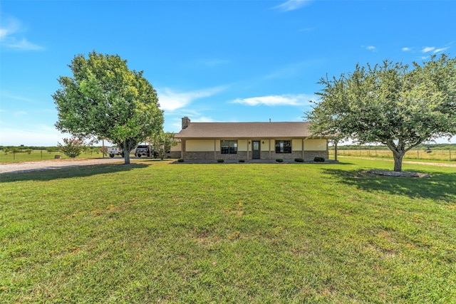 ranch-style house featuring a front lawn