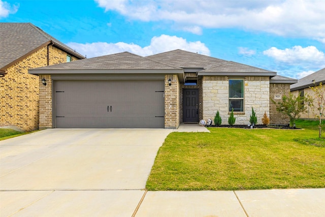 view of front of property with a garage and a front yard