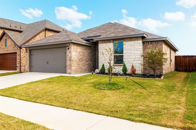 view of front of property with a garage and a front yard