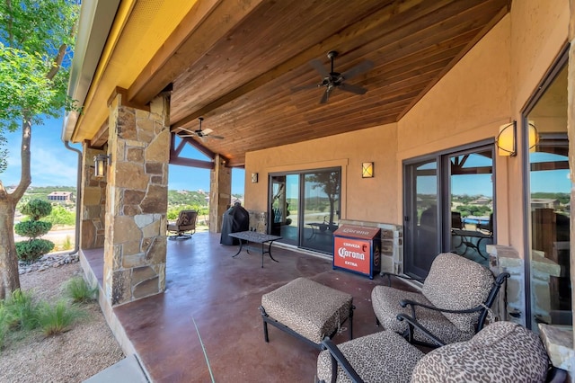 view of patio featuring ceiling fan