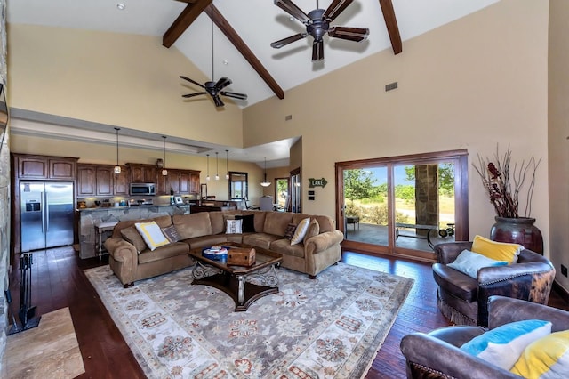 living room featuring beam ceiling, high vaulted ceiling, ceiling fan, and dark wood-type flooring