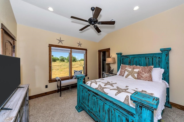 bedroom with ceiling fan, light carpet, and vaulted ceiling