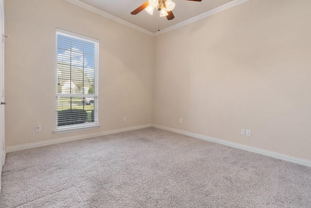 empty room featuring ornamental molding, carpet, and ceiling fan