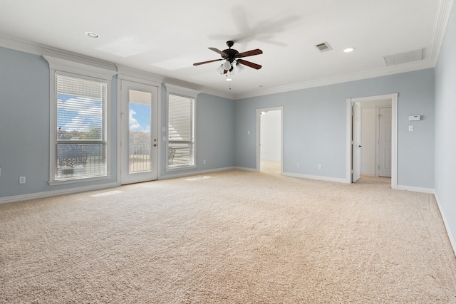 empty room with ceiling fan, light carpet, and ornamental molding