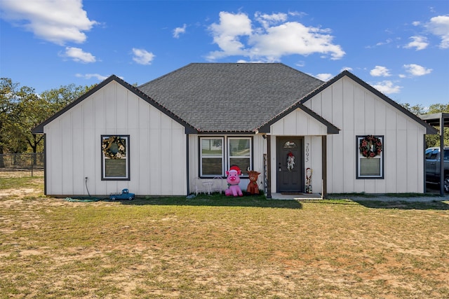 modern farmhouse with a front lawn