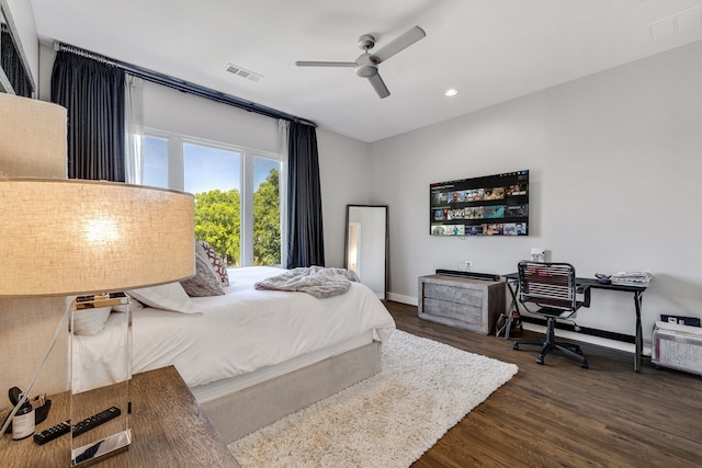 bedroom featuring ceiling fan and dark wood-type flooring