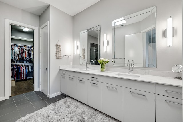 bathroom with tile patterned flooring and vanity