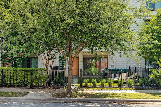 view of property hidden behind natural elements