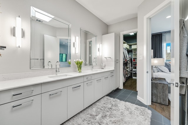 bathroom featuring tile patterned floors and vanity