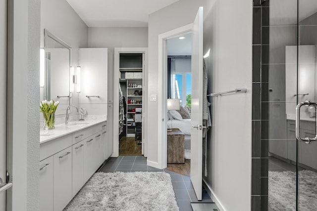 bathroom featuring vanity, wood-type flooring, and walk in shower