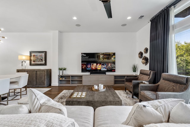 living room featuring hardwood / wood-style flooring and ceiling fan