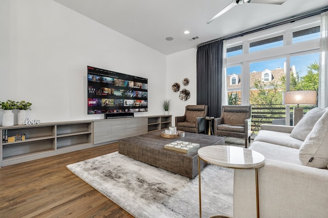 living room with hardwood / wood-style flooring and ceiling fan