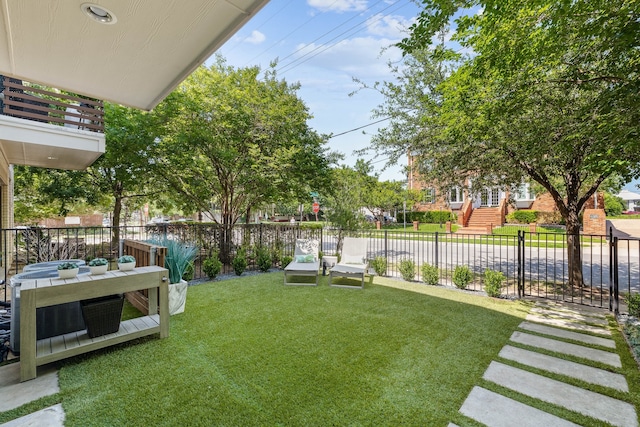 view of yard featuring a balcony