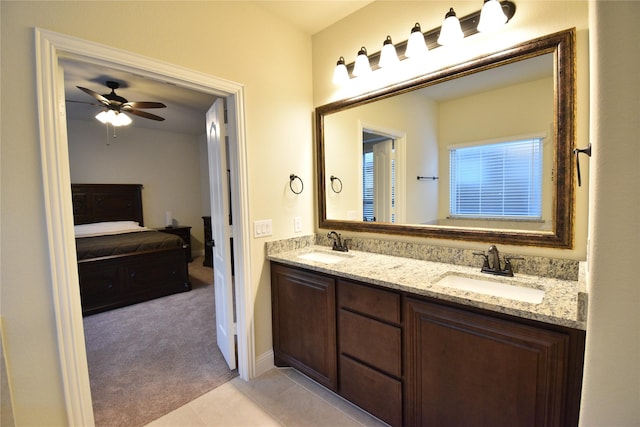 bathroom with tile patterned floors, ceiling fan, and vanity