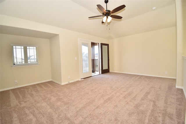 unfurnished room featuring light colored carpet, ceiling fan, and lofted ceiling