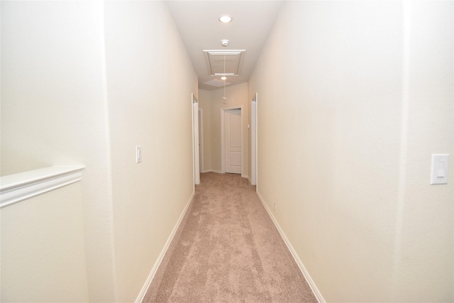 corridor with light colored carpet