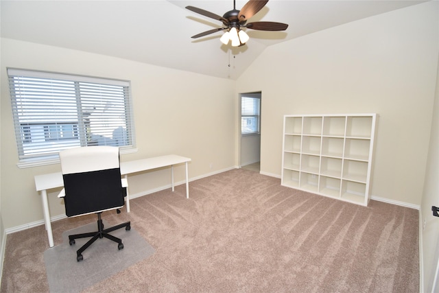 carpeted office space with ceiling fan and vaulted ceiling