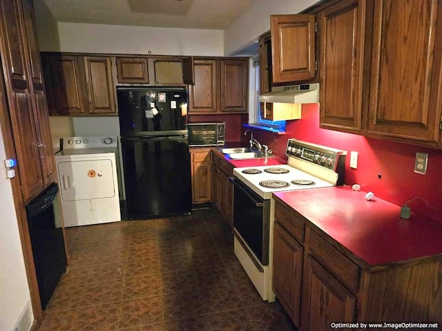 kitchen with black appliances, extractor fan, sink, and washer / clothes dryer