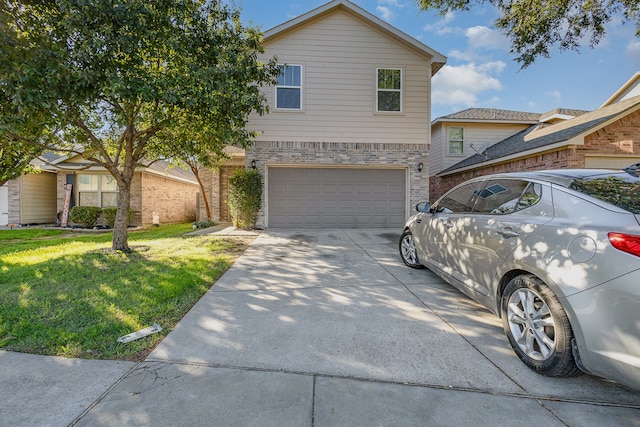 view of front of house with a garage and a front yard