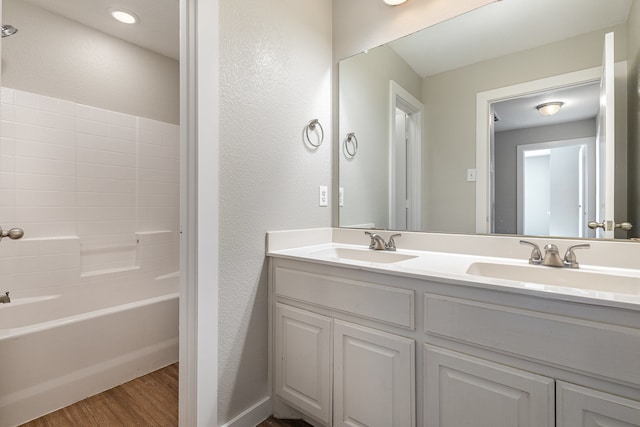 bathroom with vanity and wood-type flooring