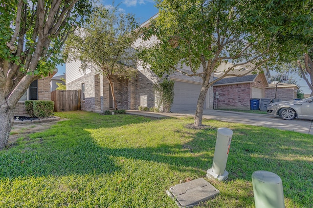 view of front of property with a garage and a front yard