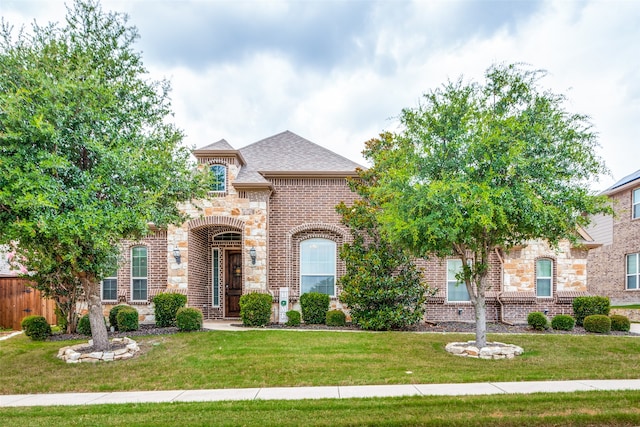 view of front of home with a front lawn