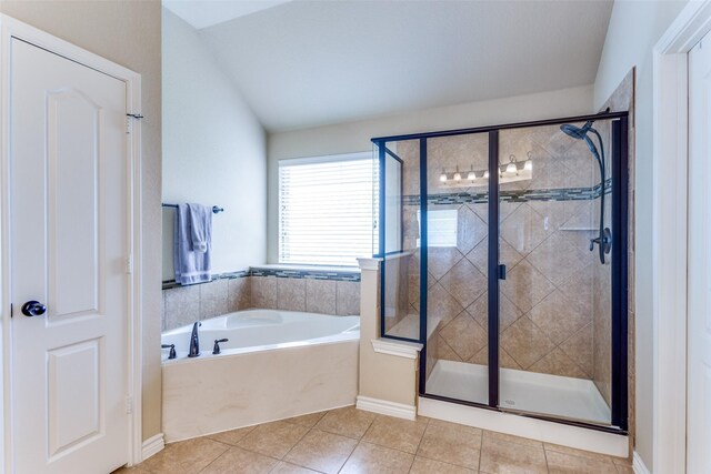 bathroom with tile patterned flooring, plus walk in shower, and vaulted ceiling