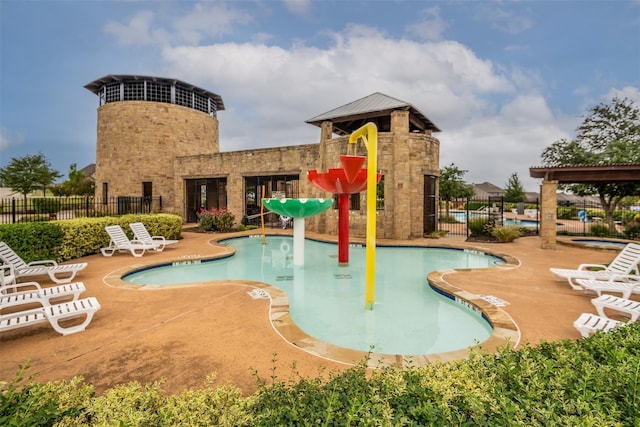 view of pool featuring a patio