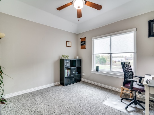 carpeted office featuring ceiling fan