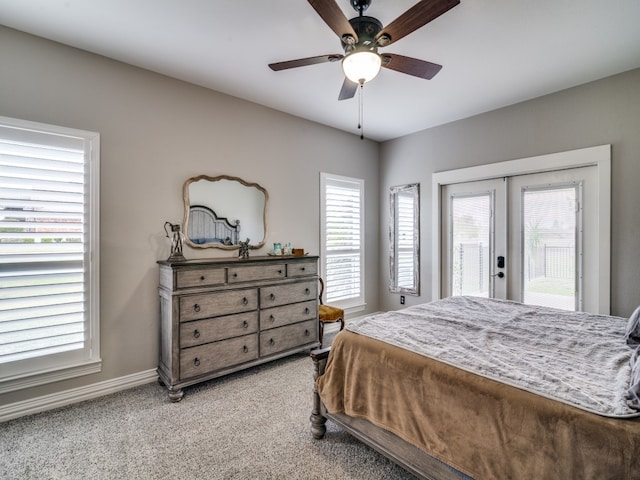 carpeted bedroom with access to outside, ceiling fan, and french doors