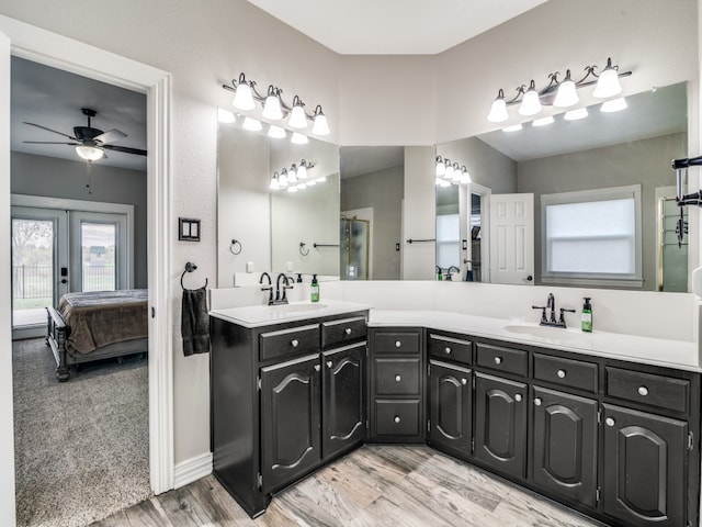 bathroom featuring french doors, vanity, ceiling fan, and wood-type flooring