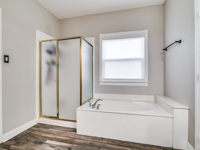 bathroom featuring independent shower and bath and wood-type flooring