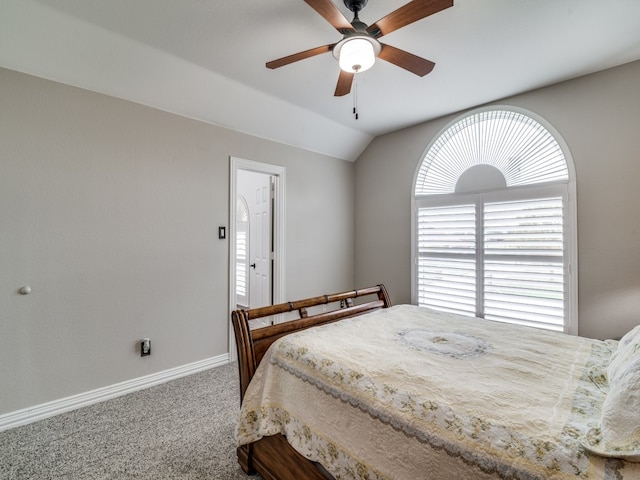 carpeted bedroom featuring ceiling fan and lofted ceiling