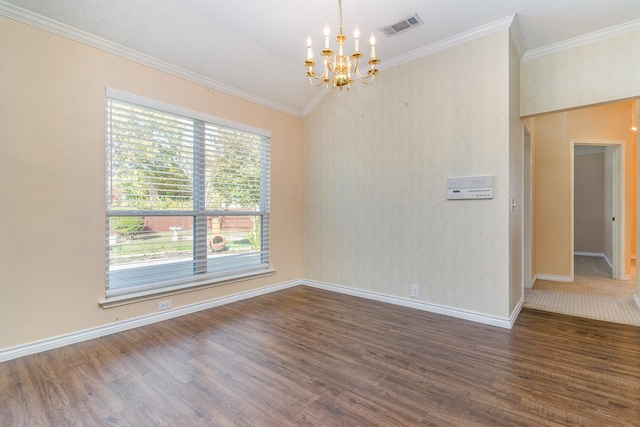 empty room featuring ornamental molding, lofted ceiling, dark hardwood / wood-style floors, and a notable chandelier