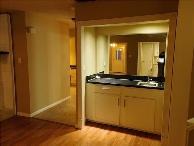 bathroom featuring sink and wood-type flooring