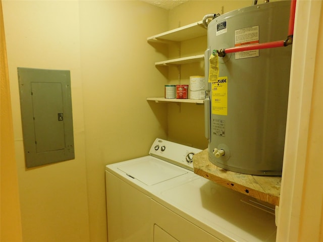 washroom featuring electric panel, electric water heater, and washer and dryer