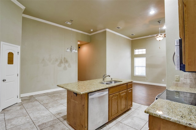 kitchen with a kitchen island with sink, sink, light tile patterned flooring, and stainless steel appliances