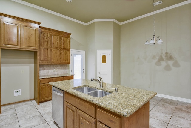 kitchen with a center island with sink, sink, hanging light fixtures, stainless steel dishwasher, and a chandelier