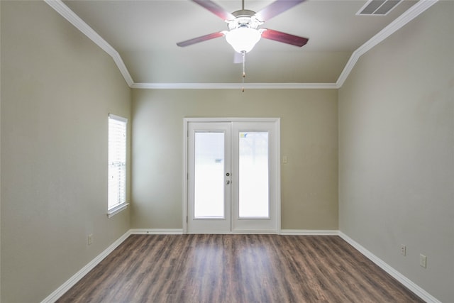 spare room with crown molding, french doors, ceiling fan, and dark hardwood / wood-style floors